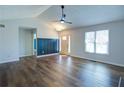 Bright living room featuring beautiful laminate flooring, a modern ceiling fan, and ample natural light at 2228 Arbor Forest Sw Trl, Marietta, GA 30064