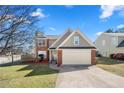 Charming two-story home with a well-manicured lawn and a two-car garage at 401 Windstream Sw Dr, Marietta, GA 30060