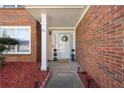 Welcoming front entrance with brick facade and decorative landscaping at 401 Windstream Sw Dr, Marietta, GA 30060
