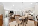 Open-concept living space features a dining area, fireplace, and comfortable seating, creating an inviting atmosphere at 1929 Finnish Ln, Kennesaw, GA 30152