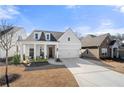 Charming single-Gathering home featuring a well-manicured lawn, a two-car garage, and a welcoming front porch at 1929 Finnish Ln, Kennesaw, GA 30152