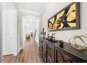 Hallway features beautiful hardwood floors and elegant decor, leading to a cozy living space at 1929 Finnish Ln, Kennesaw, GA 30152