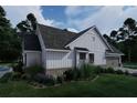 Charming home with white siding, dark roof, lush landscaping, and inviting curb appeal, perfect for modern living at 237 Barbara Sw Ln, Mableton, GA 30126
