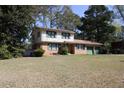 Charming brick home with a two-car garage and a well-maintained front yard at 3274 Jodeco Pl, Jonesboro, GA 30236