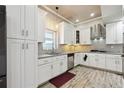 Modern kitchen with white cabinets, stainless steel appliances, and granite countertops at 1503 Westwood Sw Ave, Atlanta, GA 30310
