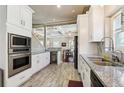 Well-equipped kitchen featuring stainless appliances, a wine cooler and granite countertops at 1503 Westwood Sw Ave, Atlanta, GA 30310