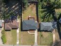 Aerial view of a home with a backyard deck, surrounded by lush greenery at 1882 Rosewood Rd, Decatur, GA 30032