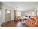 Cozy living room with hardwood floors, comfortable seating, and abundant natural light at 1893 Windsor Sw Dr, Atlanta, GA 30311