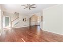 Open living space with hardwood floors, archways, stairs and neutral colors for a bright and welcoming atmosphere at 1019 Walnut Creek Dr, Woodstock, GA 30188