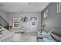 Bright living room with sleek floors, a modern staircase, and stylish contemporary decor at 21 Samuel Nw Way, Cartersville, GA 30121