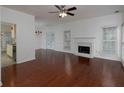 Bright living room with a fireplace, ceiling fan, and hardwood floors at 2158 Berryhill Se Cir, Smyrna, GA 30082