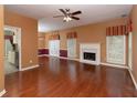 Spacious living room with fireplace, hardwood floors, and bright natural light at 2158 Berryhill Se Cir, Smyrna, GA 30082