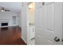 Bright living room features hardwood floors, a fireplace, and a ceiling fan at 2158 Berryhill Se Cir, Smyrna, GA 30082