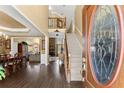 Grand foyer with hardwood floors, high ceilings, staircase and decorative glass front door at 960 Whitehawk Trl, Lawrenceville, GA 30043