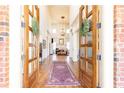 Grand foyer with high ceilings, hardwood floors, and double doors at 5352 Lacosta Ln, Alpharetta, GA 30022