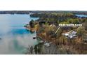 Aerial view of lakeside property at 6535 Smith Cove showing its prime location and access to the water at 6535 Smith Cove Way, Cumming, GA 30041