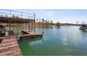 Enjoy lake life with this dock including covered boat storage and a sunny area for relaxing by the water at 6535 Smith Cove Way, Cumming, GA 30041
