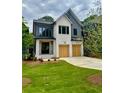 Attractive home with a well-manicured lawn and a modern design featuring a mix of brick and siding at 2583 Apple Valley Rd, Brookhaven, GA 30319
