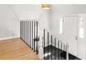 Inviting entryway with stylish black and white tile, light hardwood floors and white door at 1143 Morningside Ne Pl, Atlanta, GA 30306