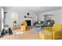 Bright living room with hardwood floors, a fireplace, and neutral colors at 1143 Morningside Ne Pl, Atlanta, GA 30306