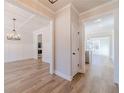 A warm and inviting view of the neutral interior featuring an open floor plan with wood-look flooring at 174 Pinewood Dr, Covington, GA 30014