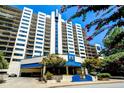 Modern high-rise condominium building with balconies and landscaped entrance in a desirable location at 1130 Piedmont Ne Ave # 907, Atlanta, GA 30309