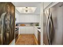 Modern kitchen with stainless steel appliances, white cabinets, and stylish backsplash at 1130 Piedmont Ne Ave # 907, Atlanta, GA 30309