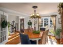 Cozy dining room featuring hardwood floors, natural light, and wainscoting details at 1354 Larson Sw Ct, Marietta, GA 30064