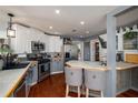 Stylish eat-in kitchen with two-toned cabinets, stainless steel appliances, and breakfast bar seating at 1354 Larson Sw Ct, Marietta, GA 30064