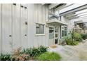 Modern front entrance with metal siding, decorative plants, and concrete walkway at 1661 La France Ne St # 102, Atlanta, GA 30307
