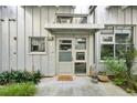 Charming front entrance with a 'Welcome Home' doormat and well-maintained landscaping at 1661 La France Ne St # 102, Atlanta, GA 30307