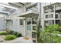 Stylish front entrance with white siding and decorative landscaping at 1661 La France Ne St # 102, Atlanta, GA 30307