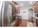 Modern kitchen with stainless steel appliances, granite countertops, and hardwood floors at 161 Dorys Way, Dallas, GA 30157