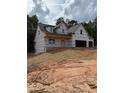 New construction home featuring a two-story design and an attached two-car garage at 210 Pinewood Dr, Covington, GA 30014