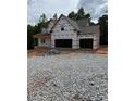 New construction home featuring a two-story design and an attached two-car garage at 210 Pinewood Dr, Covington, GA 30014