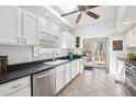 Bright kitchen featuring stainless steel appliances, white cabinets, skylight, and bar seating at 156 Sisson Ne Ave, Atlanta, GA 30317