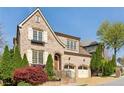 Charming brick home with a two-car garage, manicured landscaping, and inviting curb appeal at 1820 Buckhead Valley Ne Ln, Atlanta, GA 30324