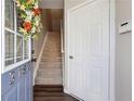 Entryway featuring stairs, a coat closet, and access to living areas at 3182 Mill Springs Cir, Buford, GA 30519