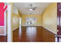 Spacious living room with abundant natural light, gleaming hardwood floors, and high ceilings at 1703 Mission Park Dr, Loganville, GA 30052
