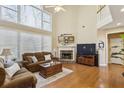 Inviting living room features a soaring ceiling, fireplace, and ample natural light at 173 Northshore Xing, Dallas, GA 30157