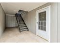 Exterior entrance featuring a metal staircase leading up to unit 120 at 320 Park Ridge Cir, Marietta, GA 30068