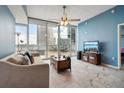 Modern living room with large windows and comfortable seating area at 3324 Peachtree Ne Rd # 814, Atlanta, GA 30326