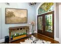 Elegant foyer showcasing a decorative rug, and an arched door that leads to outdoor views at 447 Lacy Rd, Canton, GA 30115