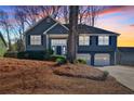 Beautiful two-story home with a two-car garage and attractive landscaping at 2593 Abbotts Glen Nw Dr, Acworth, GA 30101