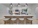 Kitchen featuring a large island with pendant lights and seating for four at 113 Priestwood Ln, Acworth, GA 30102