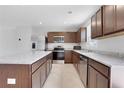 Well-lit kitchen with stainless steel appliances, granite countertops, and ample cabinetry at 8470 Limerick Lane Dr, Winston, GA 30187
