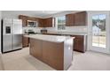 Modern kitchen featuring stainless steel appliances and a spacious center island at 8470 Limerick Lane Dr, Winston, GA 30187