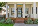 Inviting front porch with classic columns, a cozy seating area, and a welcoming entrance with charming details and curb appeal at 273 Glenwood Se Ave # B, Atlanta, GA 30312