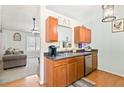 Well-lit kitchen featuring wood cabinetry, stainless steel appliances, and an open layout at 38 Wayfaring Ct, Rockmart, GA 30153