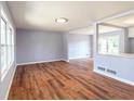 Open-concept living room with modern flooring and ample natural light at 2666 Frontier Trl, Atlanta, GA 30341